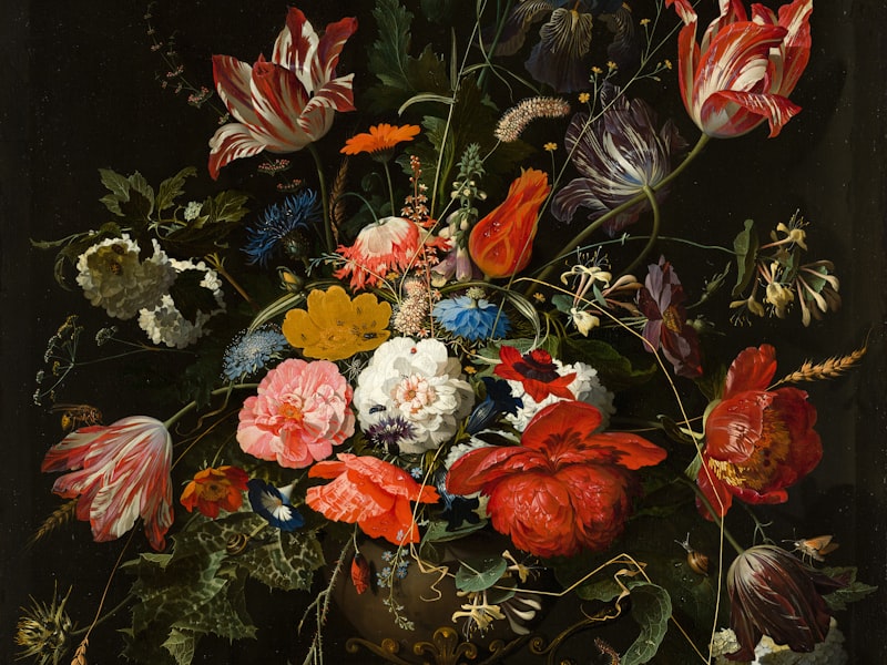 Artist painting a portrait on canvas at an easel