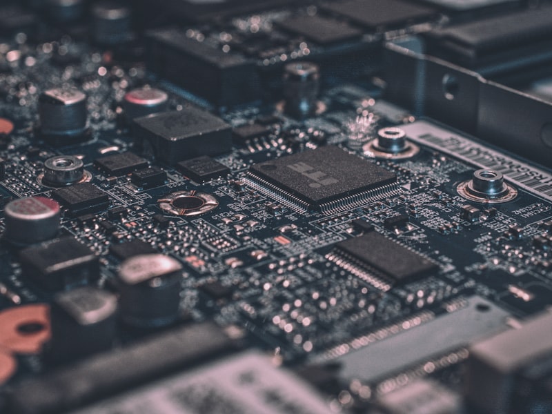 Close-up of soldering iron tip on electronic component