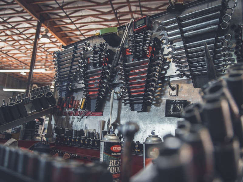 Red jack stands supporting vehicle in home garage