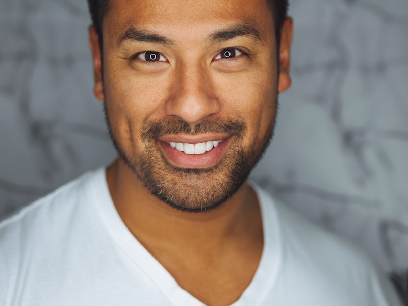 Car with hood open being worked on in garage bay