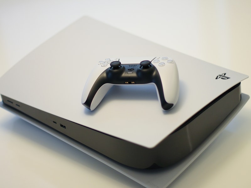 PS5 DualSense controllers in white and black