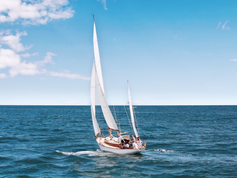 White yacht cutting through deep blue Mediterranean sea